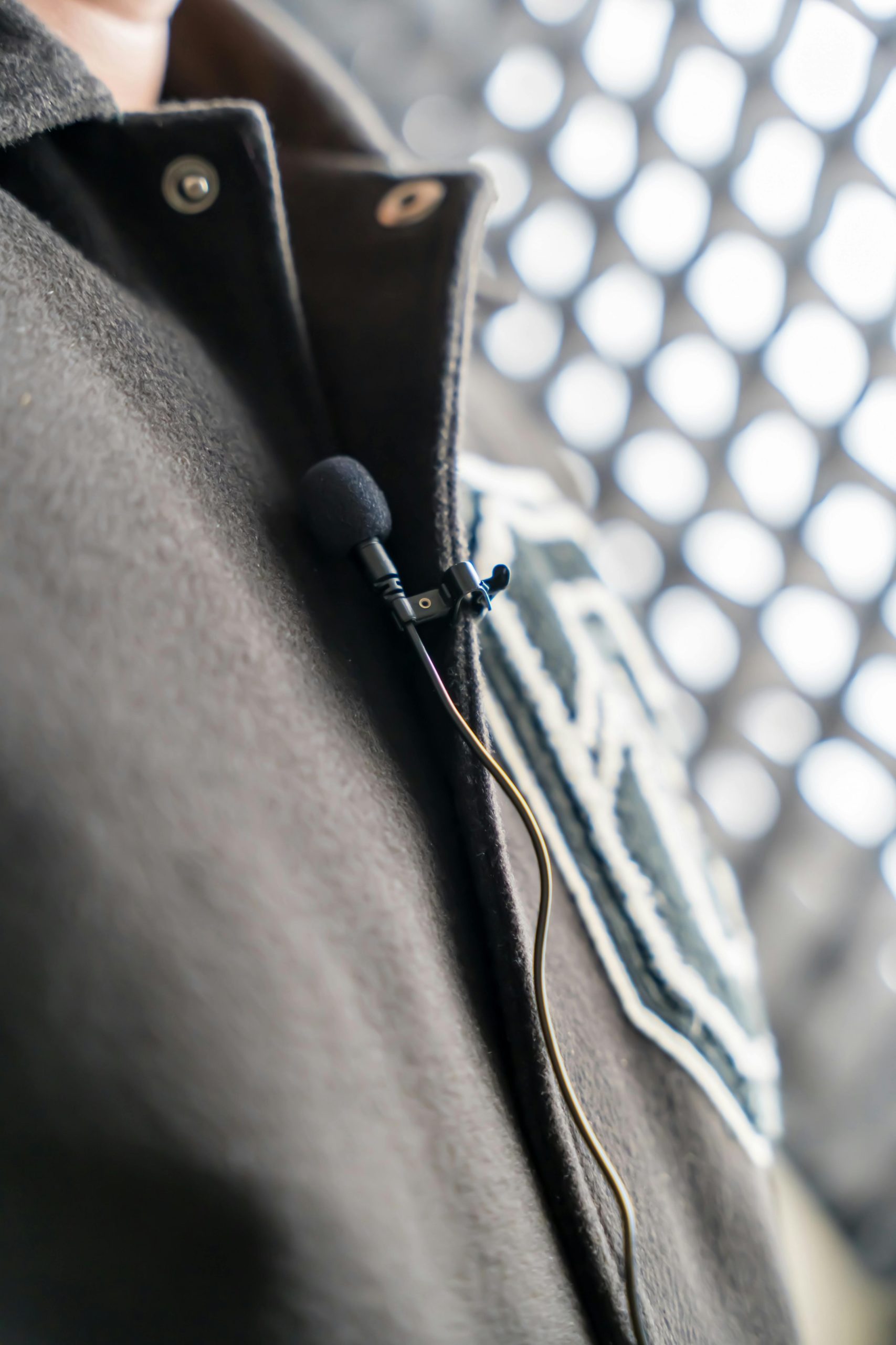 Lavalier microphone clipped on a jacket