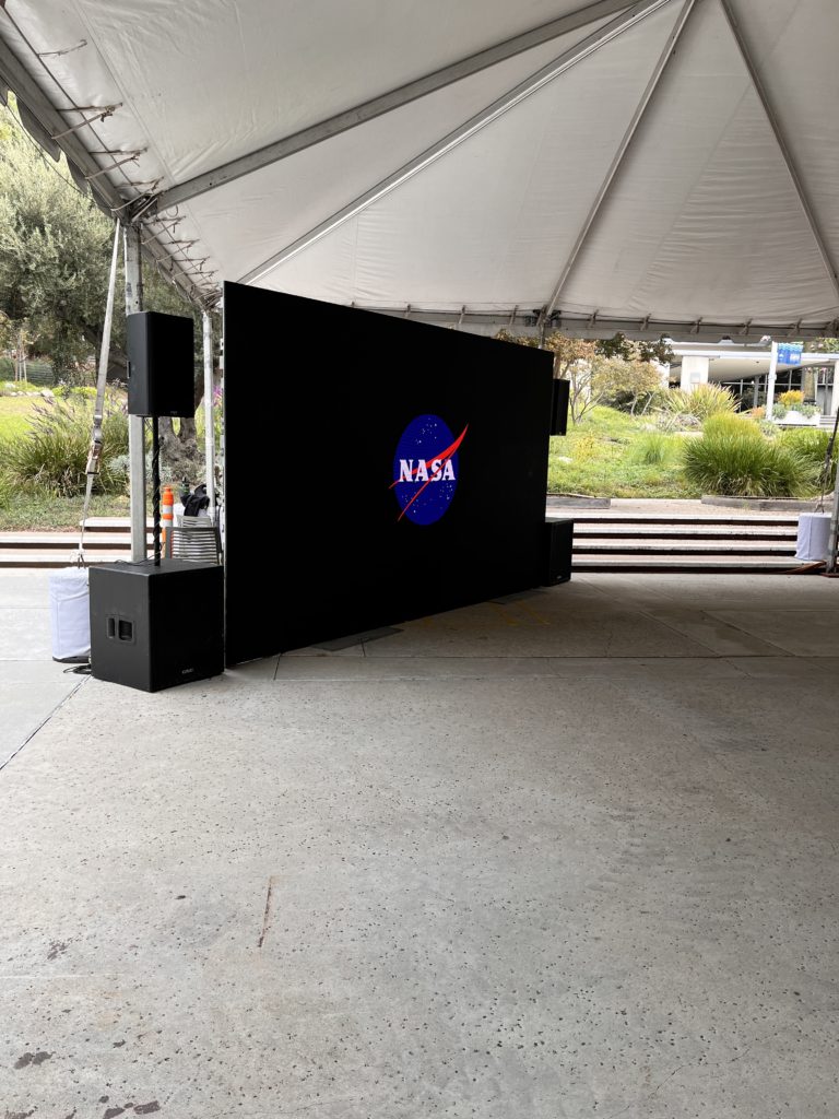 A LED video wall rental with speaker rentals displaying the NASA logo
